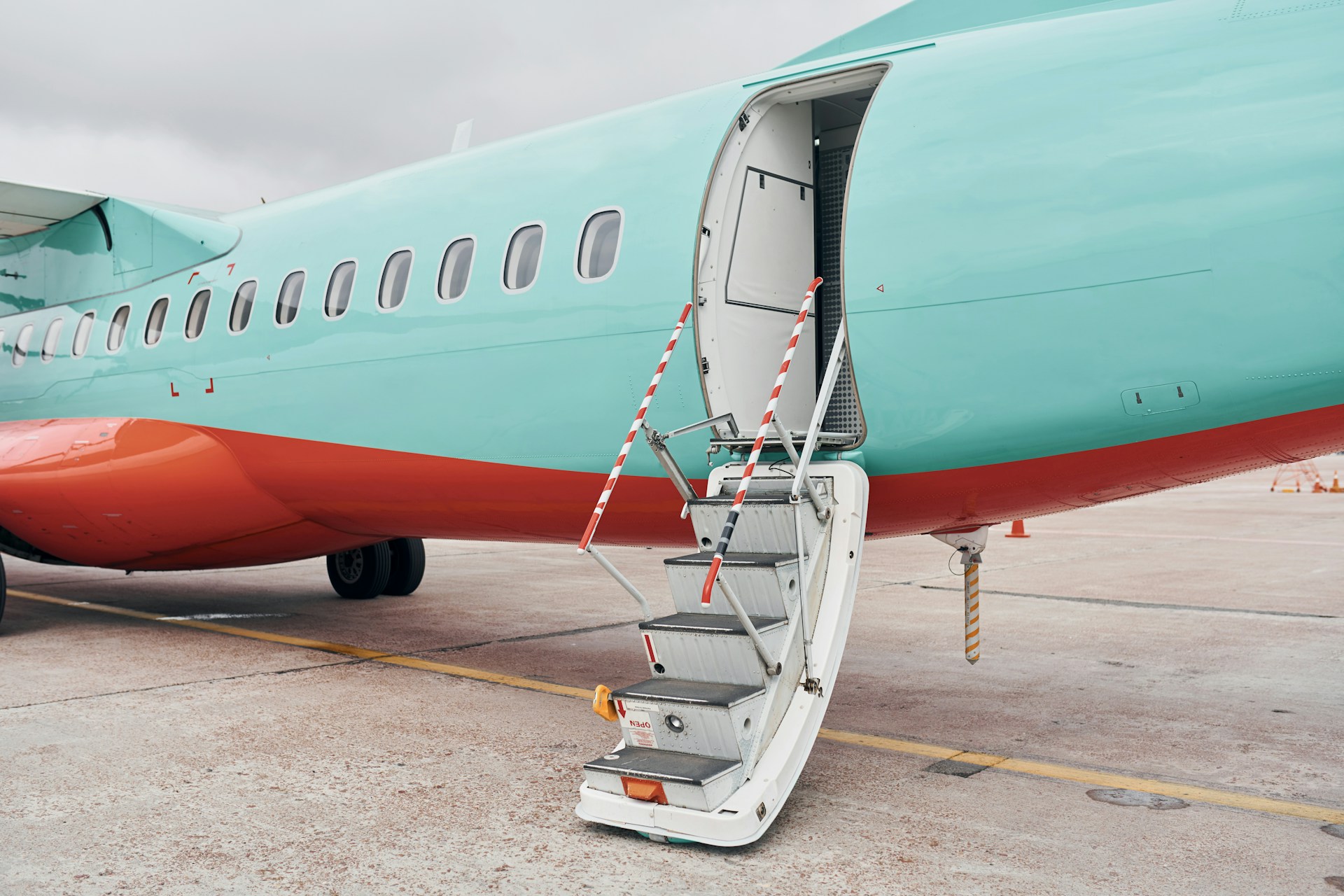 Passengers boarding an aircraft in an organized sequence before departure