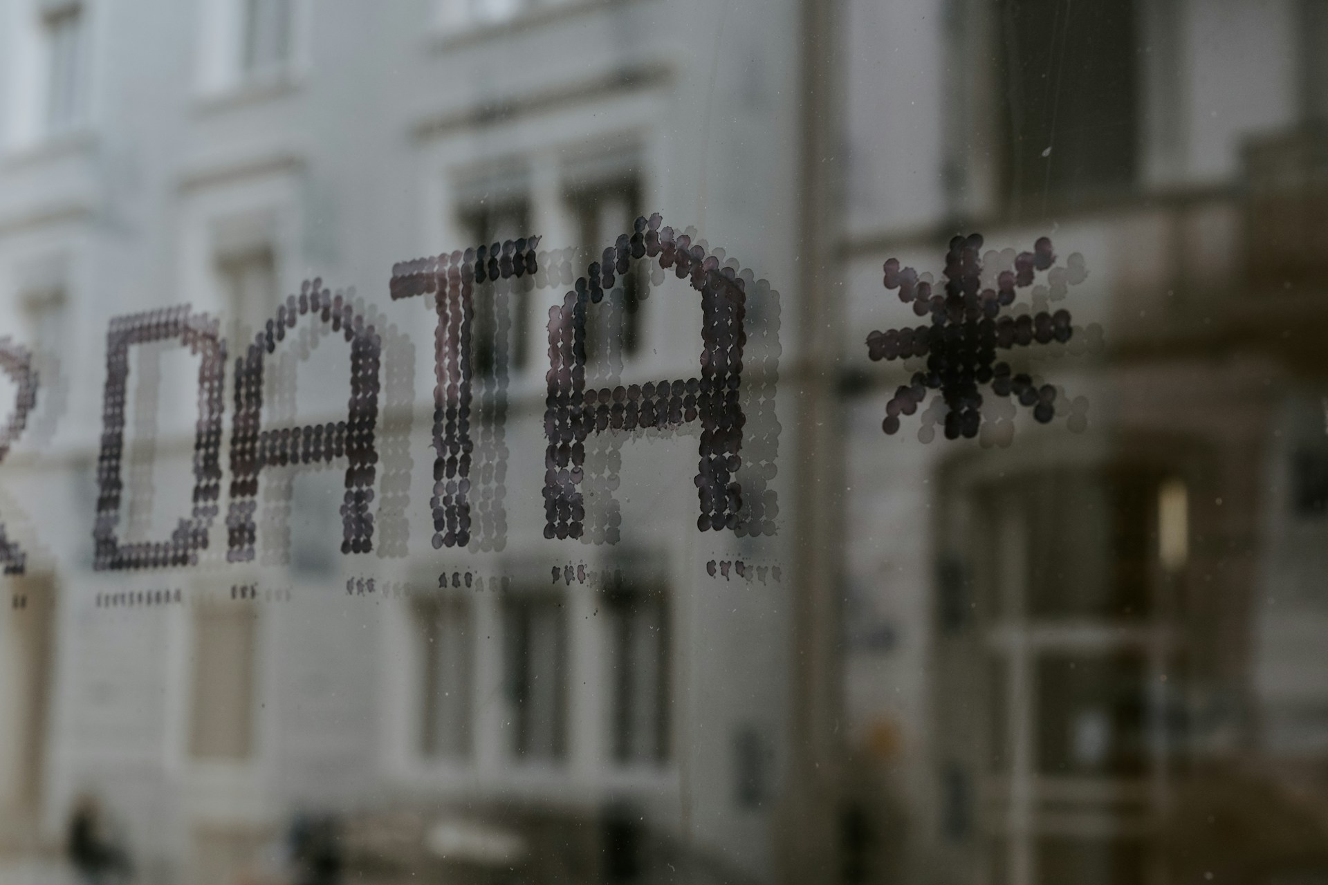 Close-up of a window with the word “Data” printed on the glass
