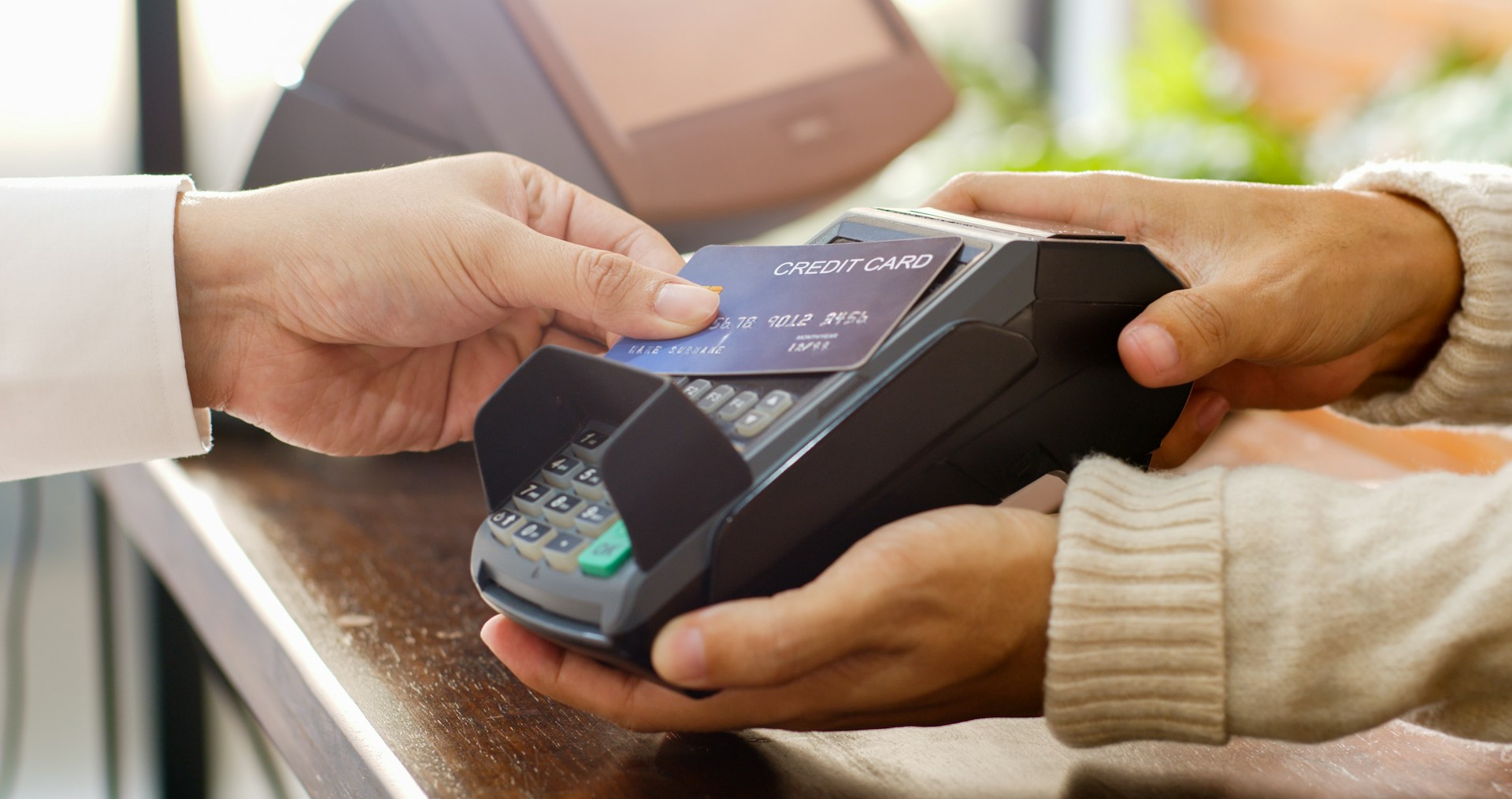 Credit card being used at a payment terminal during a transaction