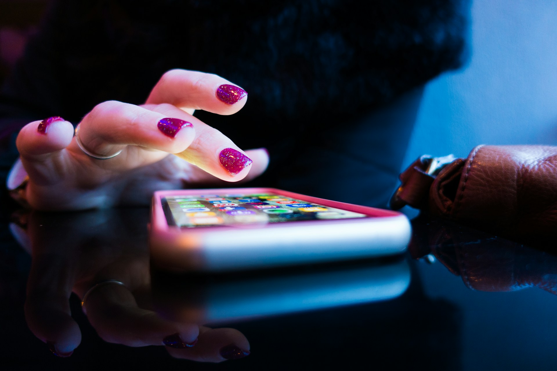 Person holding a smartphone while looking at the screen