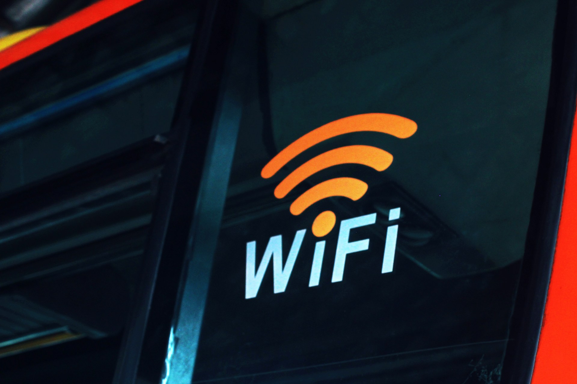 Close-up of a Wi-Fi symbol displayed on the side of a bus