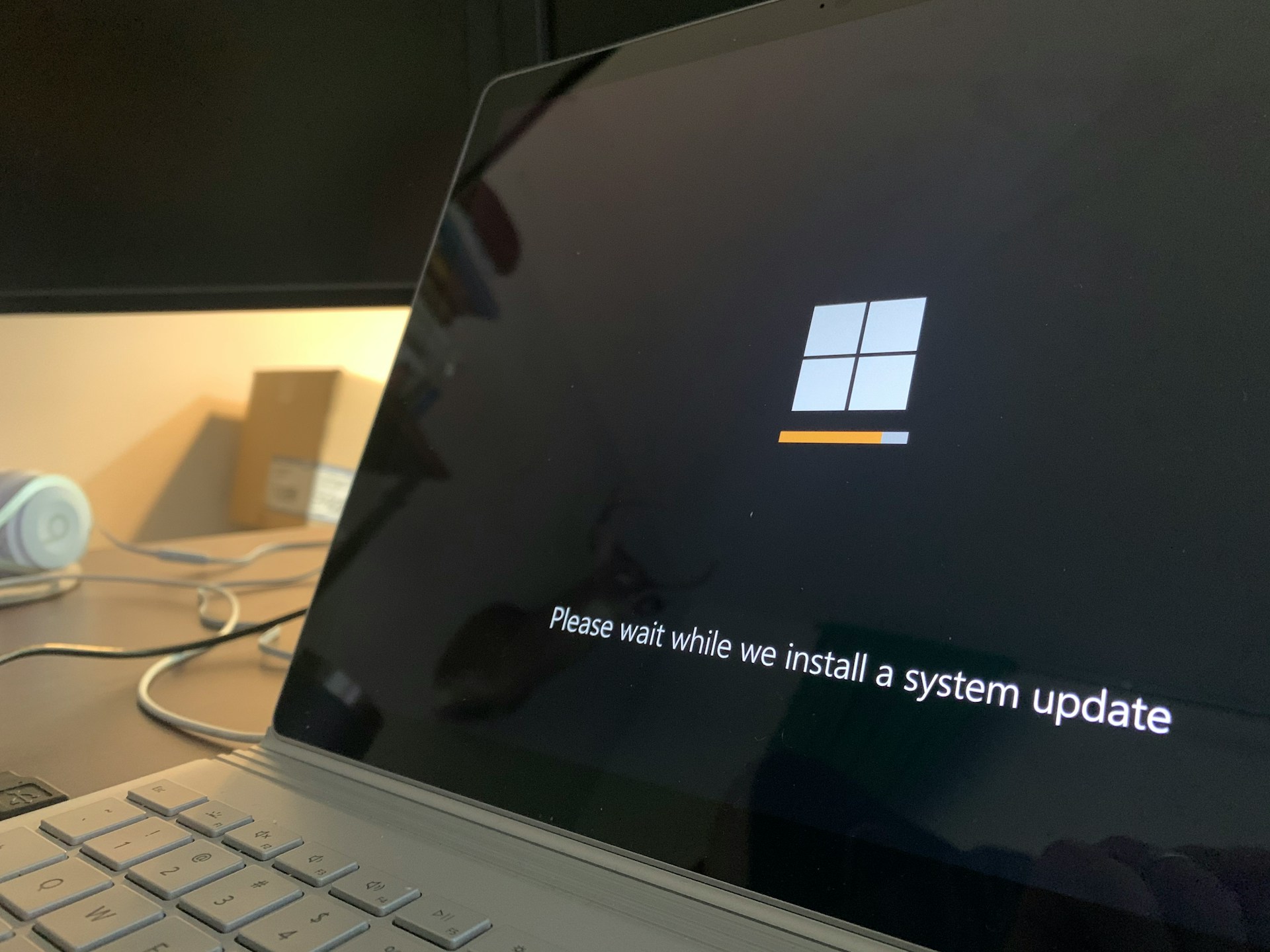 Laptop computer on a desk with screen visible