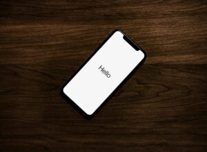 Smartphone on a table displaying a setup or welcome screen after reset