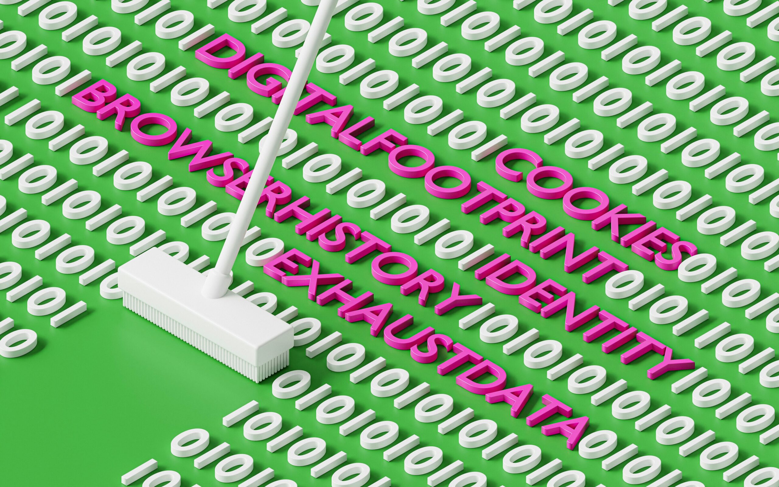 Laptop screen displaying a website cookie consent popup next to a cleaning mop on a green surface