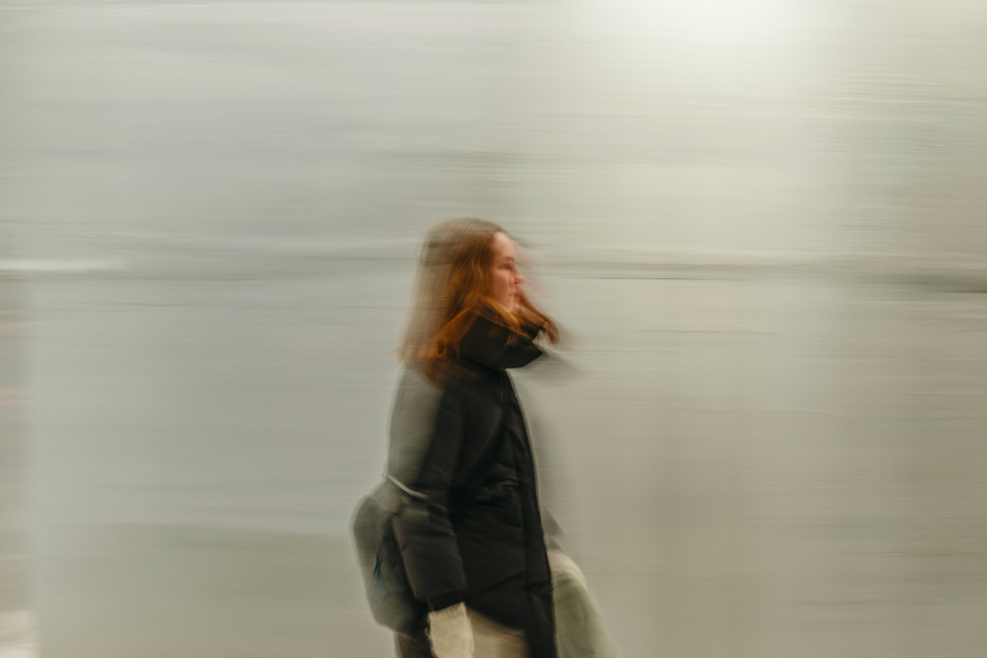 Blurred view of a person walking outdoors, illustrating temporarily unclear vision.