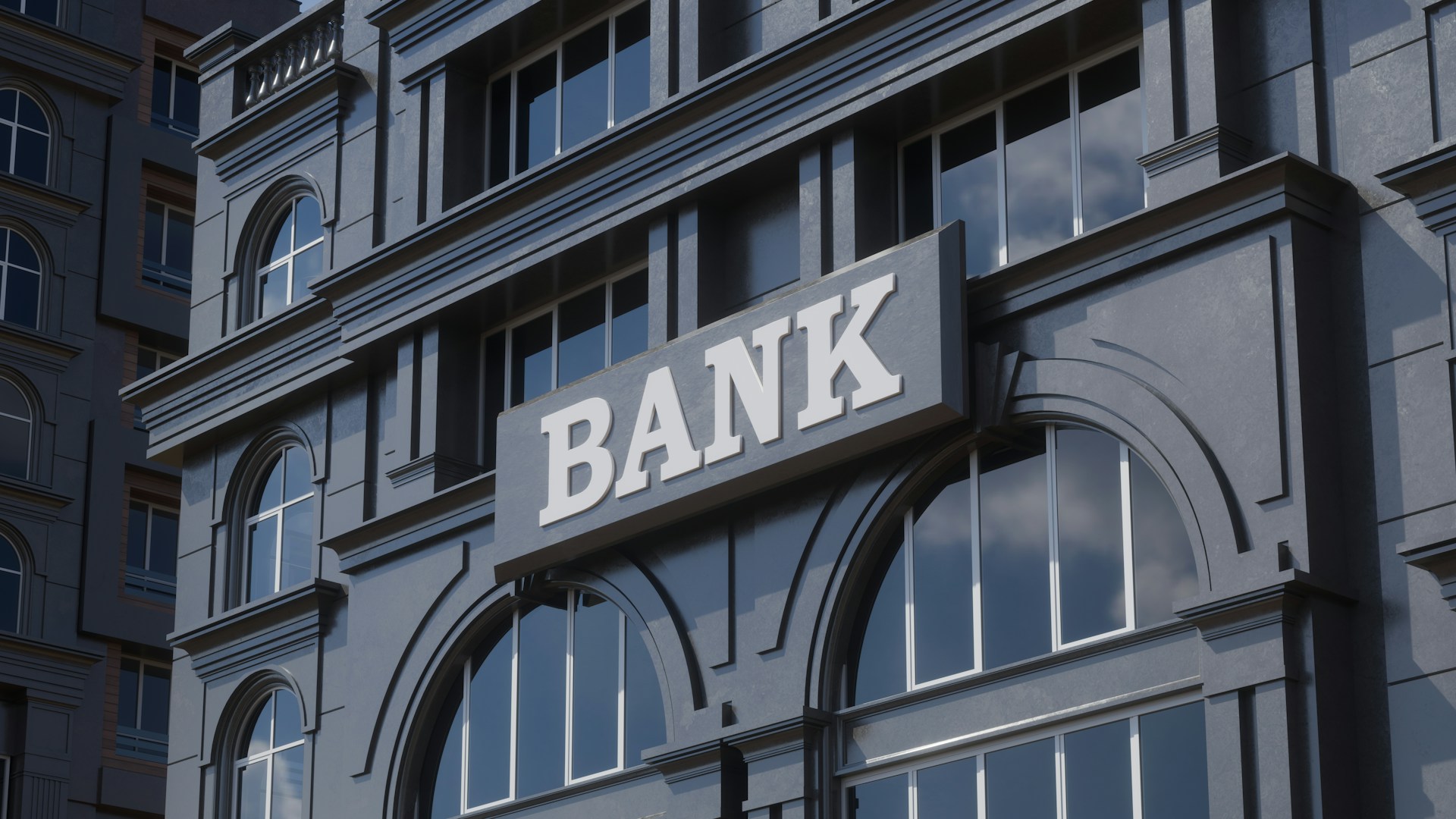 Modern bank building with large arched windows representing a financial institution where bank accounts are opened.
