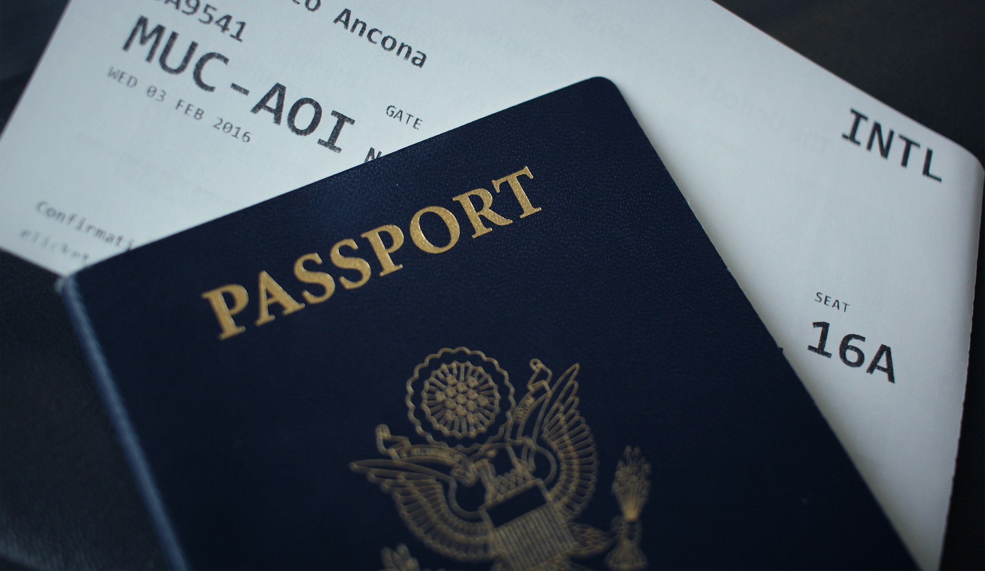 Passport booklet placed on top of official travel documents
