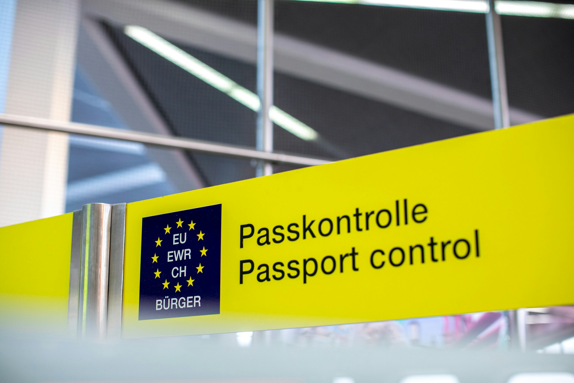 Passport control signs directing international travelers at an airport