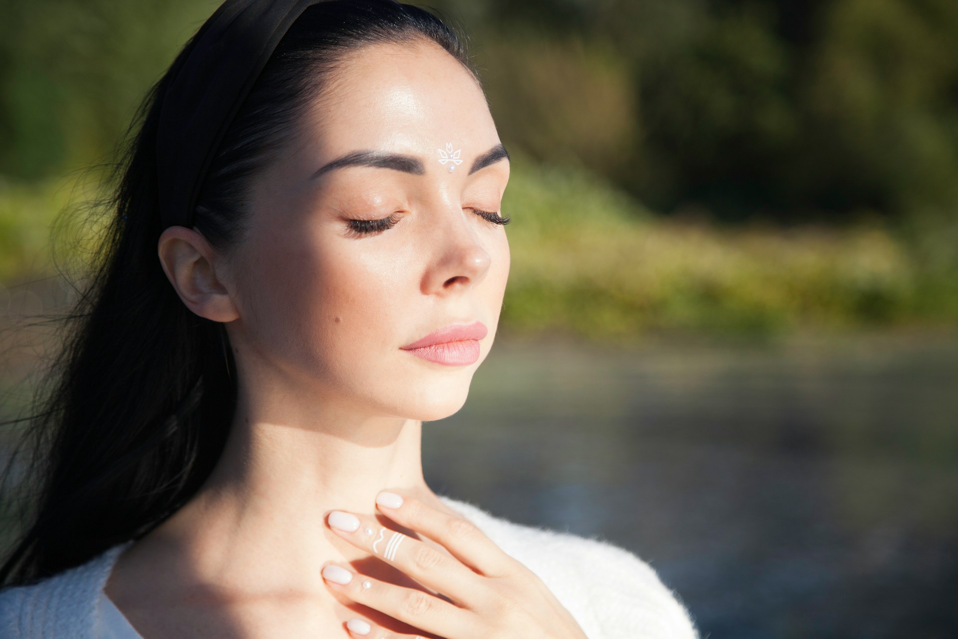 Person with hands on their chest taking a deep breath.