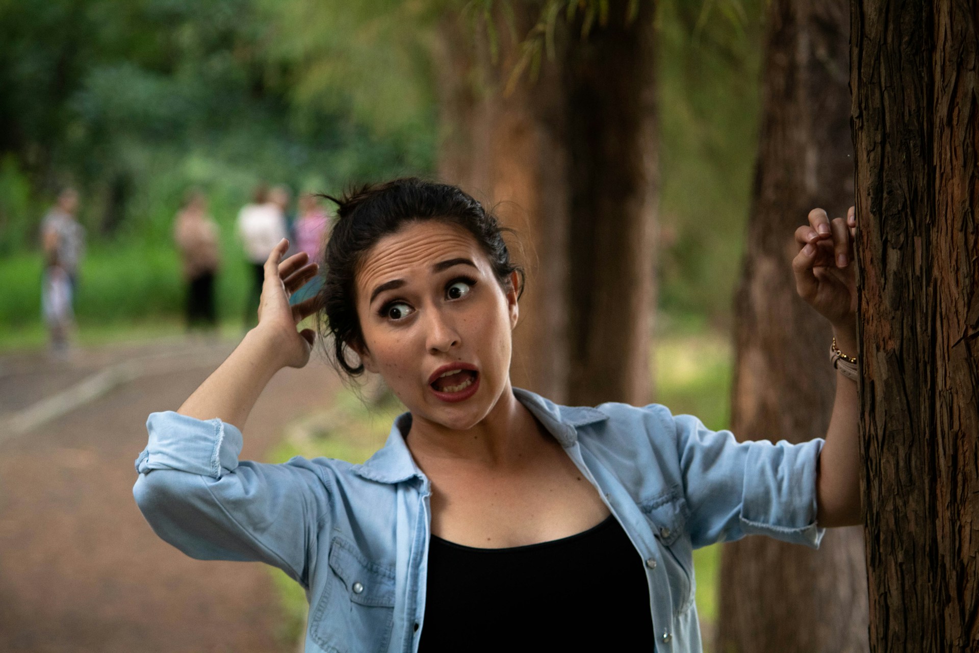 Person showing a startled reaction while experiencing a sudden moment of surprise